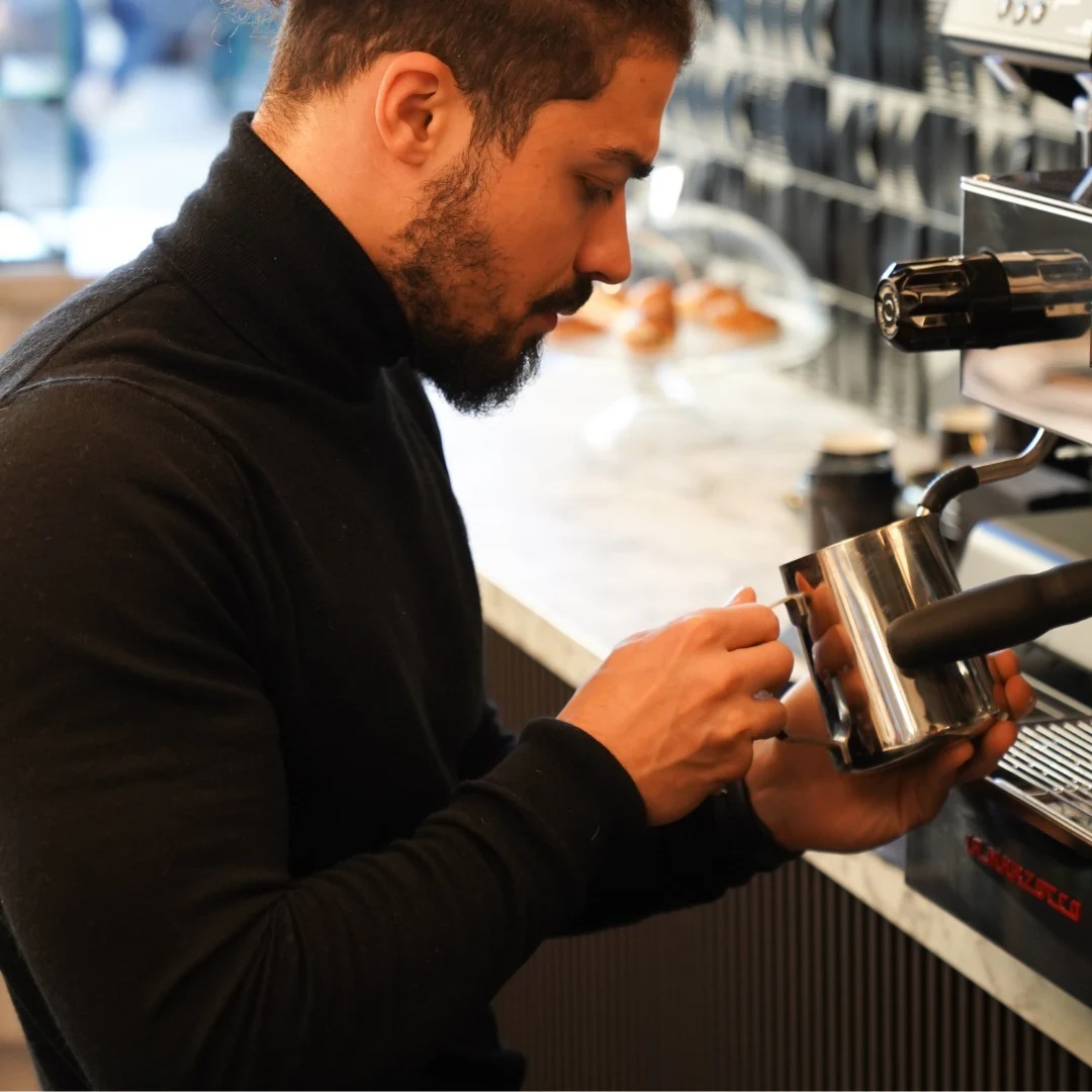 Well-organized coffee shop prep area with structured workflow stations